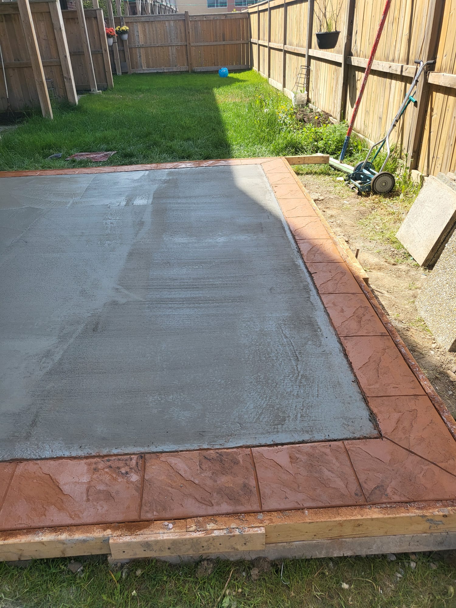 stamped-concrete-patio-installation-oakville-backyard